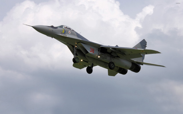 Fighter jet cloudy sky landing #2 free wallpaper - medium preview image