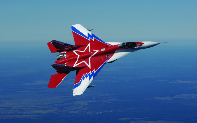 Red white fighter jet flying free wallpaper - medium preview image