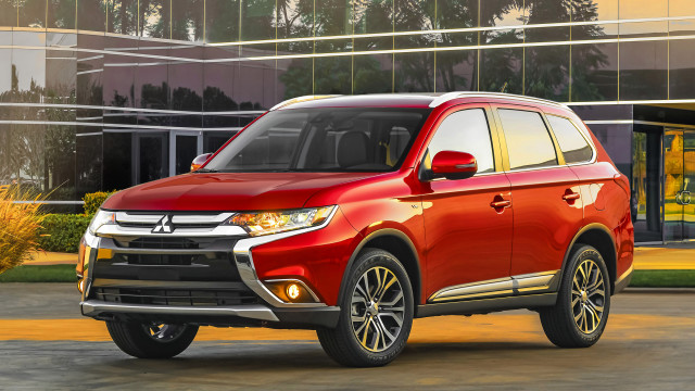 Red suv parked building glass free wallpaper - medium preview image