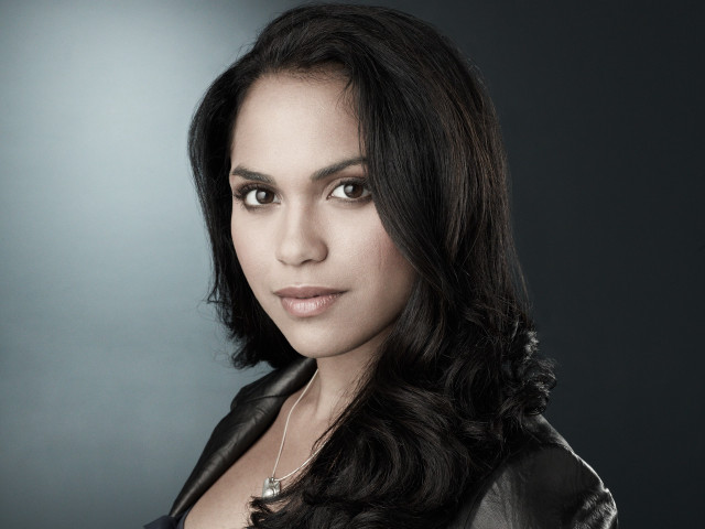 Woman longhair blackjacket darkgray background free wallpaper - medium preview image