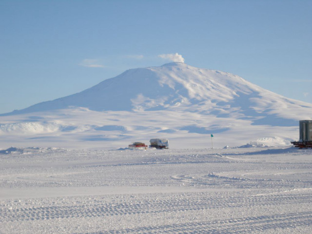Snowy field mountain truck tracks free wallpaper - medium preview image