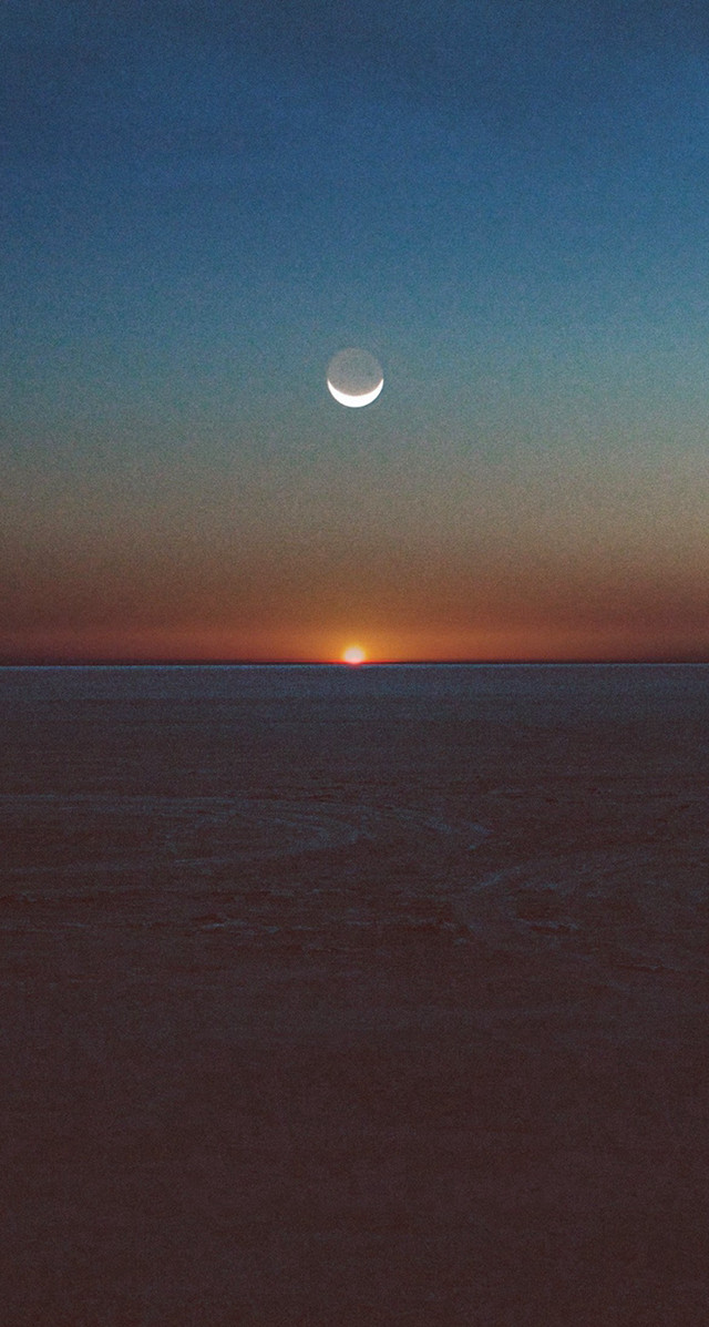 Sunset halfmoon distant moon ocean free wallpaper - medium preview image