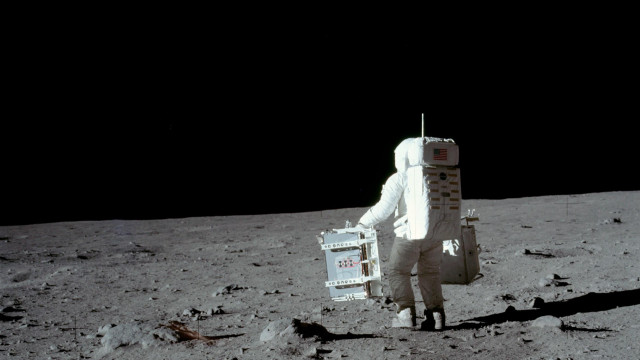Man white suit walking moon free wallpaper - medium preview image