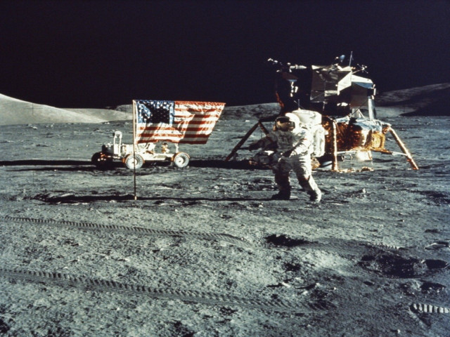 Astronaut moon flag vehicle wheels free wallpaper - medium preview image