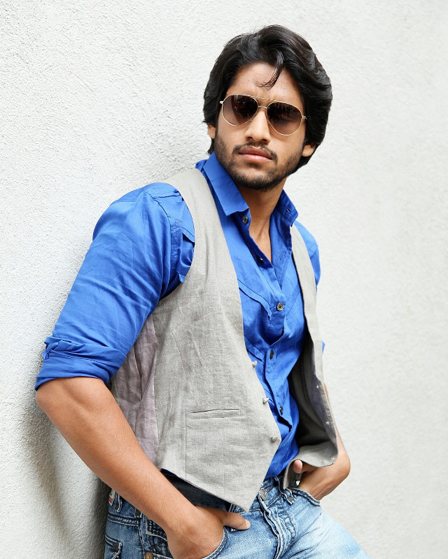 Man vest sunglasses leaning wall free wallpaper - medium preview image