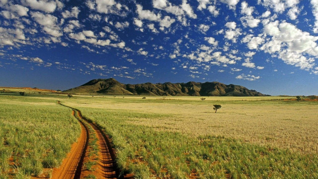 Dirt road field mountains clouds free wallpaper - medium preview image