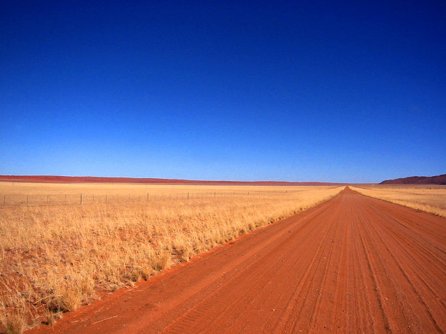 Dirt road dry grass blue free wallpaper - medium preview image