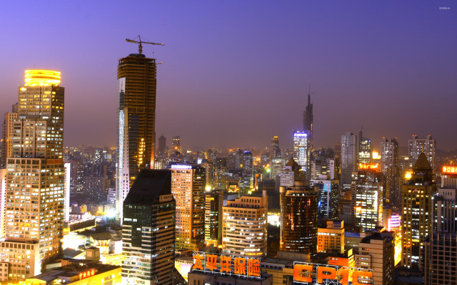 City skyline night cranes buildings free wallpaper - medium preview image