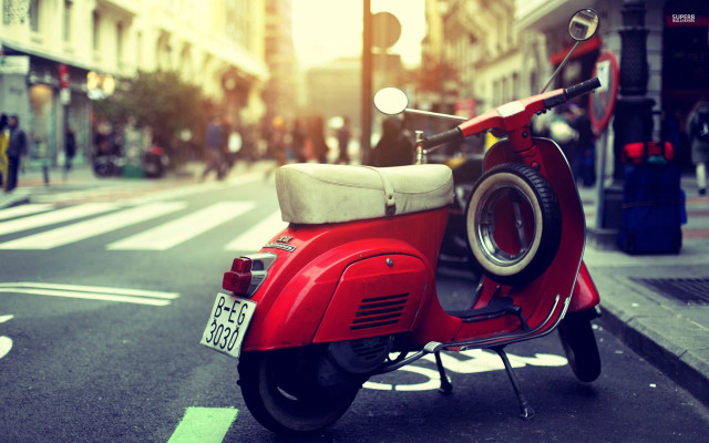 Red scooter parked street traffic free wallpaper - medium preview image