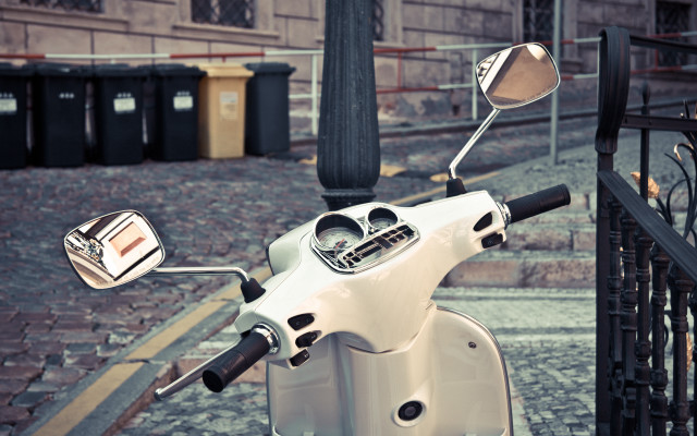 White scooter parked street fence free wallpaper - medium preview image