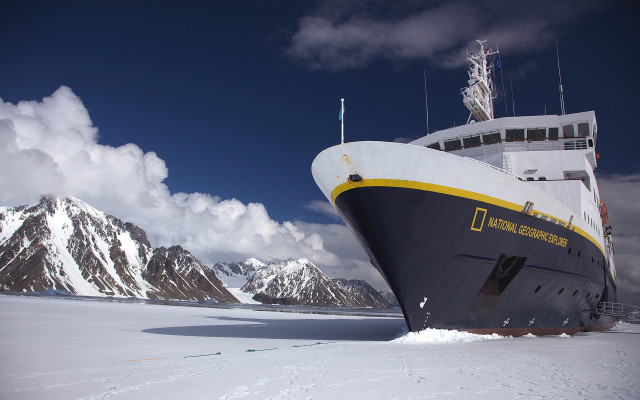 Large boat snow mountains clouds free wallpaper - medium preview image