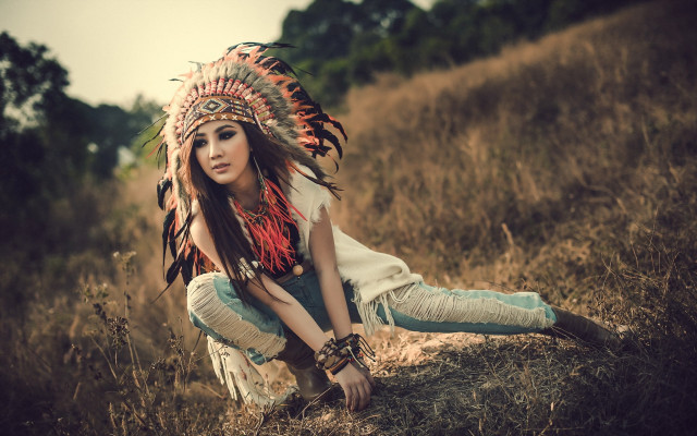 Woman headdress kneeling field grass free wallpaper - medium preview image