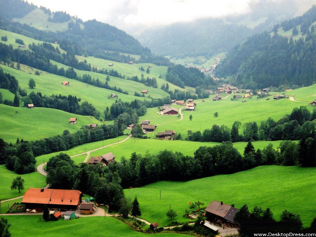 Green valley houses trees clouds free wallpaper - medium preview image