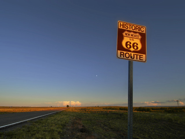 Road sign mountain sky ocean free wallpaper - medium preview image