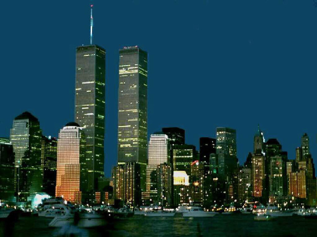 City skyline boat water nighttime free wallpaper - medium preview image