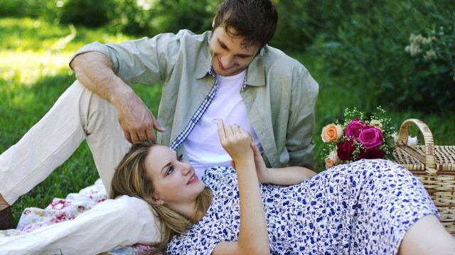 Man woman picnic blanket grass free wallpaper - medium preview image