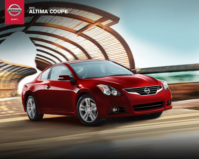 Red car driving street building free wallpaper - medium preview image