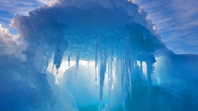 Ice cave icicles blue sky free wallpaper - medium preview image