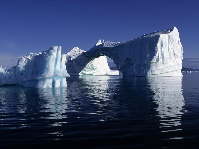 Iceberg ocean shoreline boat blue free wallpaper - medium preview image