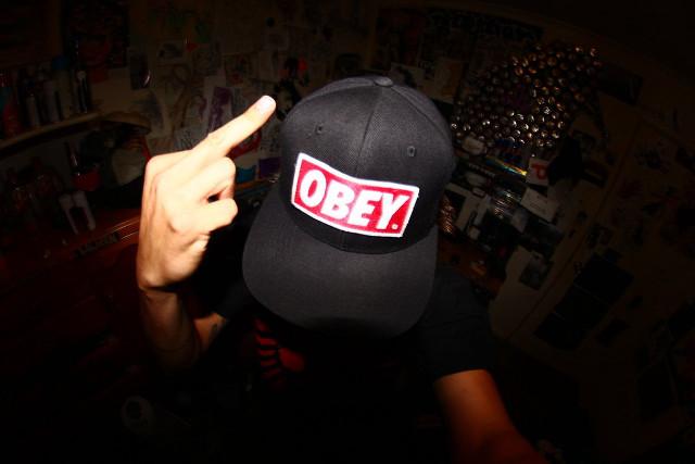 Person hat sticker pointing camera free wallpaper - medium preview image