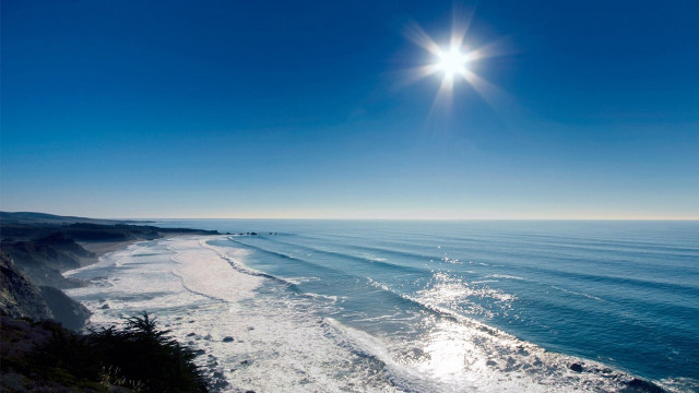 Beach sun cliff surfboard water free wallpaper - medium preview image