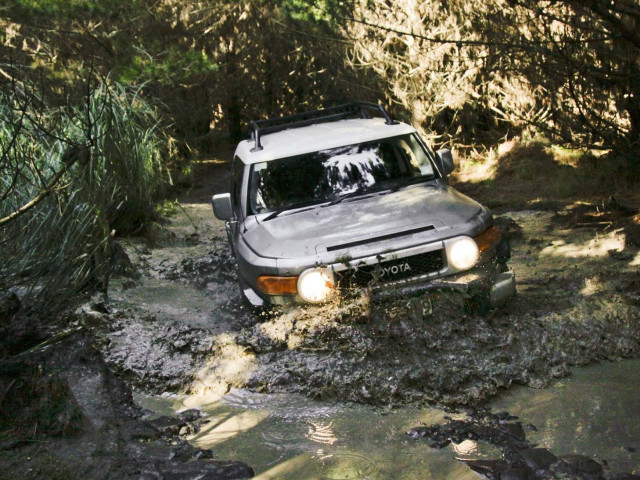 Car driving muddy road woods free wallpaper - medium preview image
