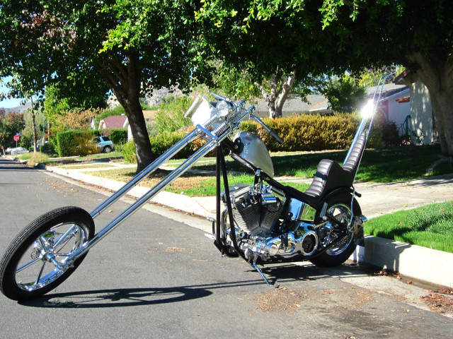 Motorcycle parked road tree sidewalk free wallpaper - medium preview image