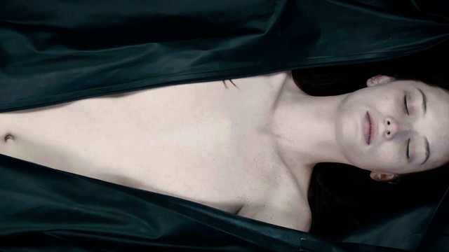 Woman eyes closed laying black free wallpaper - medium preview image