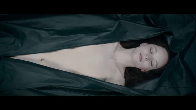 Woman lying black bag sleeping free wallpaper - medium preview image