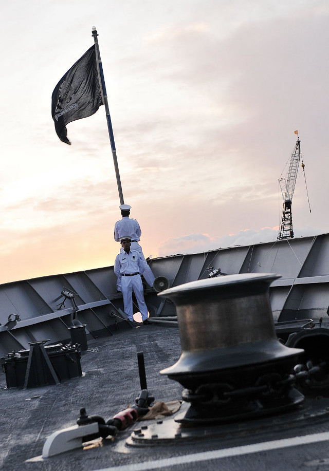 Man boat flag gun deck free wallpaper - medium preview image