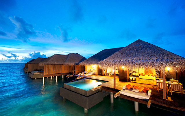 Huts on water beach night free wallpaper - medium preview image