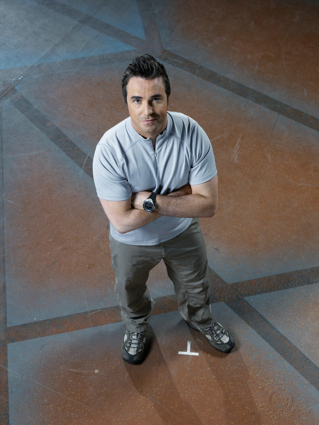 Man crossed arms tile floor free wallpaper - medium preview image