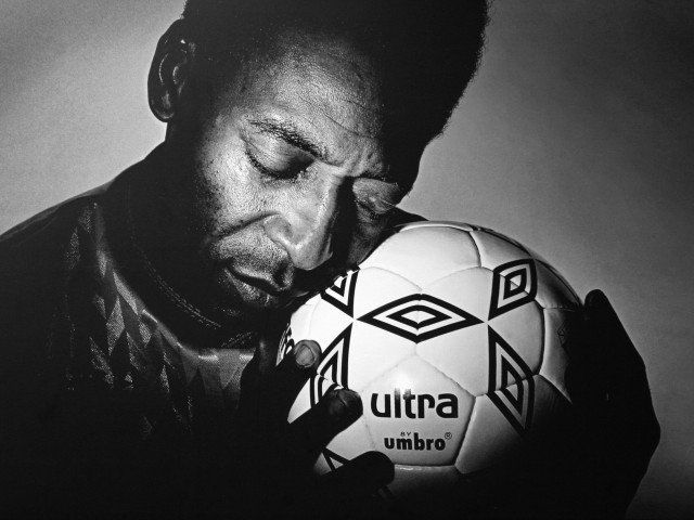 Man holding soccer ball sad free wallpaper - medium preview image