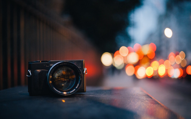 Camera ledge blurry lights moon free wallpaper - medium preview image