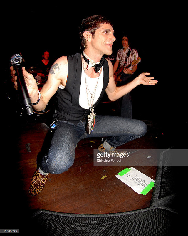 Man microphone stage black vest free wallpaper - medium preview image