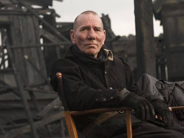 Man sitting destroyed building fire free wallpaper - medium preview image