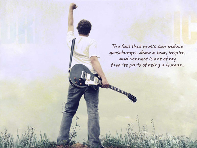 Man holding guitar quote music free wallpaper - medium preview image
