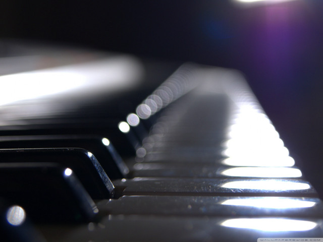 Piano keyboard closeup light blurry free wallpaper - medium preview image