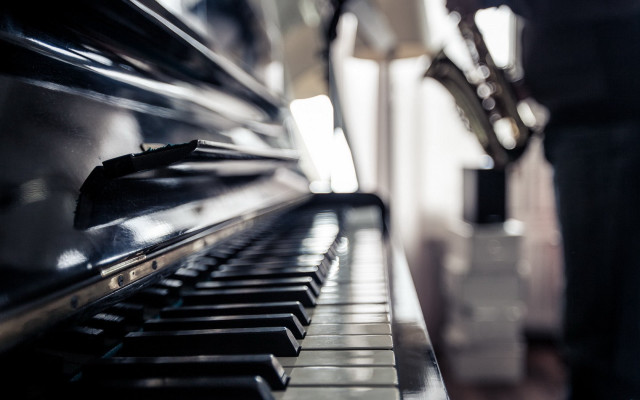 Person standing piano room window free wallpaper - medium preview image