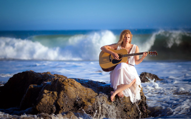 Woman sitting rock playing guitar free wallpaper - medium preview image