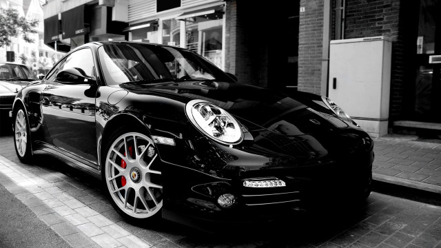 Black porsche parked street building free wallpaper - medium preview image
