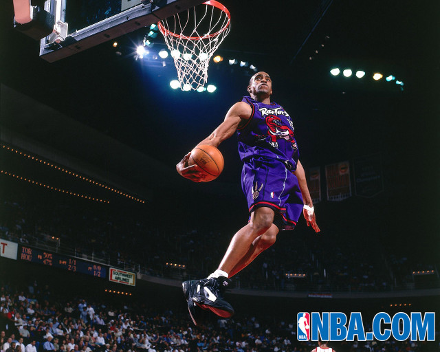 Man purple uniform dunking basketball free wallpaper - medium preview image