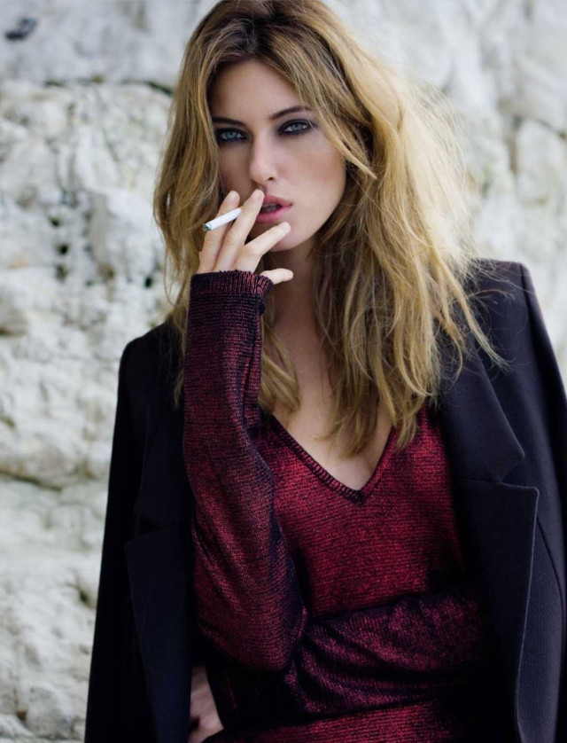 Woman smoking cigarette rock wall free wallpaper - medium preview image