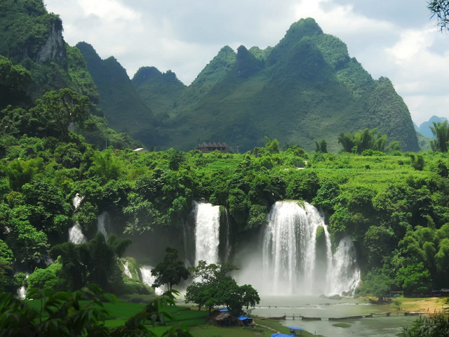 Waterfall forest umbrella mountains nature free wallpaper - medium preview image