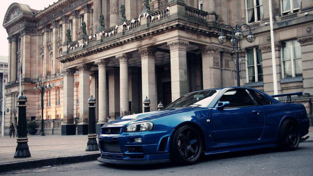 Blue car building street corner #2 free wallpaper - medium preview image