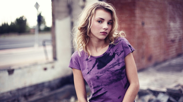 Woman skateboard brick wall standing free wallpaper - medium preview image