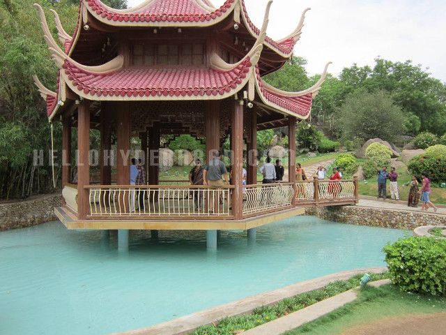 Pavilion people park pond trees free wallpaper - medium preview image