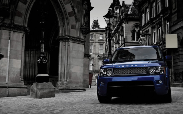 Blue land rover cobblestone street free wallpaper - medium preview image