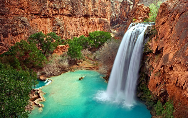 Waterfall man boat cliff blue free wallpaper - medium preview image