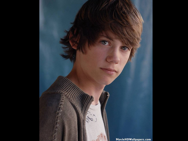 Young man brown jacket white free wallpaper - medium preview image